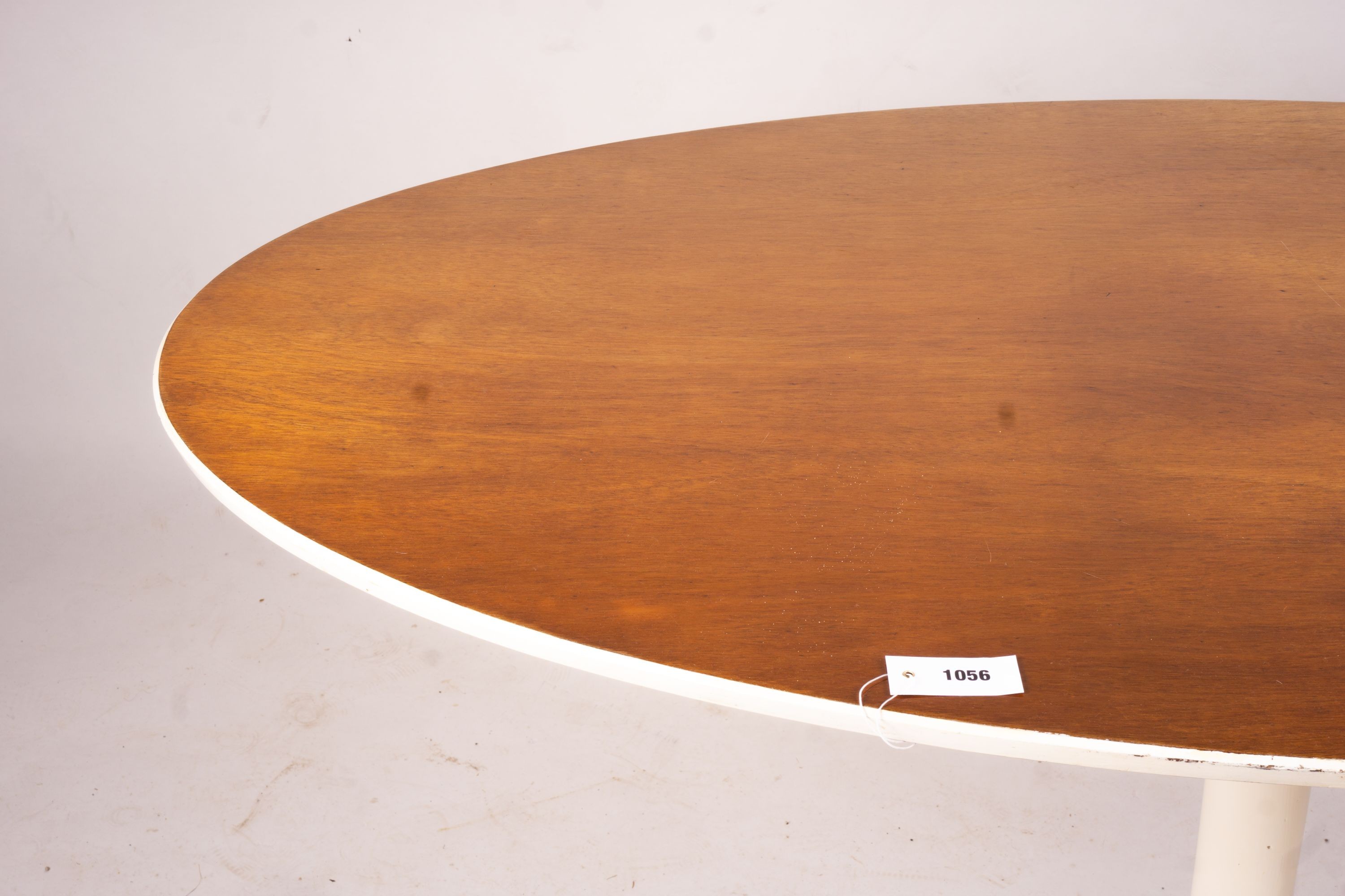 An Arkana style tulip base teak top oval dining table, length 152cm, depth 91cm, height 76cm